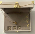 Charm Bar 14kt gold plated necklace with three extra pendants in a nude treasure box